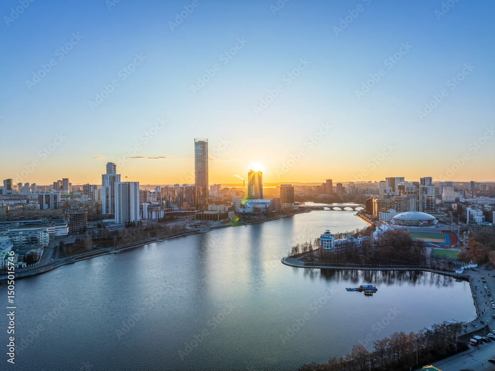 Obraz premium Yekaterinburg aerial panoramic view in spring at sunset. Yekaterinburg city and pond in spring or autumn.