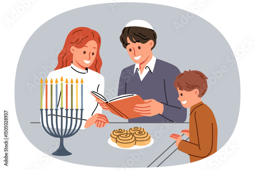 Jewish family celebrates day of hanukkah and reads holy book together, standing near table and minors. Jewish mom and dad read encyclopedia to little son, talking about traditions of people of israel