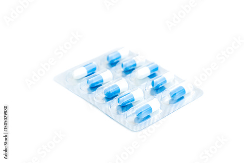 White and blue medical pills in transparent blister pack isolated on white background, Medical pills capsule