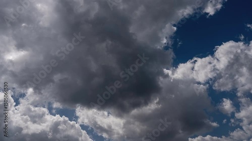 Loopable 4K ProRes Seamless Timelapse of Dramatic Clouds in Blue Sky – White and grey clouds drifting across a vivid blue sky. Ideal for backgrounds, transitions, and cinematic use