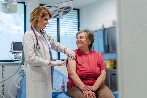 Elderly patient being vaccinated by doctor.