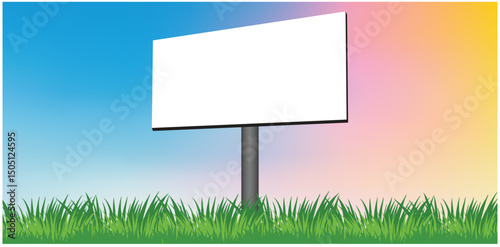 Blank advertising billboard on green grass with a blue sky