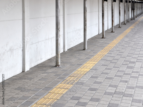 rough tactile tile for guiding visually impaired person on tile sidewalk