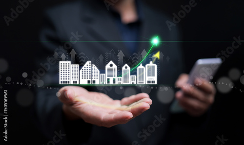 Real estate growth concept with building icons and rising curve on hand, symbolizing property investment, market expansion, and realestate development.