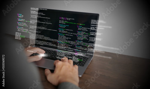 Hands of a programmer types on a laptop displaying programming code, symbolizing coding tech, software development, web applications. IT solutions, and digital technology