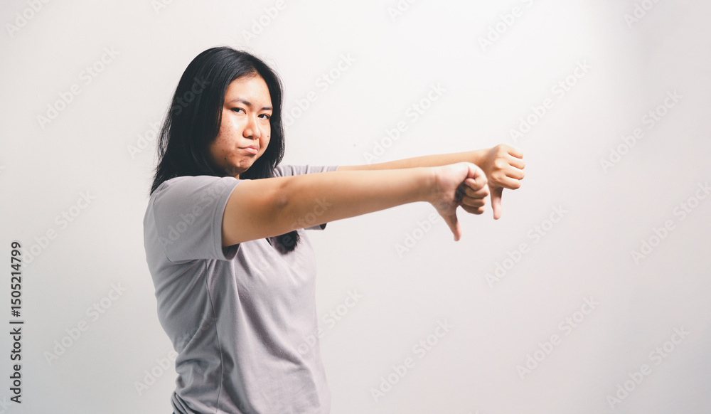 Asian girl expresses dislike, person express negative feeling, concept business complaint from customer ensuring employee satisfaction negative feedback to prevent mental strain customer dislike Asian girl expresses dislike, person express negative feeling, concept business complaint from customer ensuring employee satisfaction negative feedback to prevent mental strain customer dislike