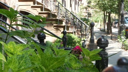 New York City townhouse building, Brooklyn Heights residential district, USA. Brownstone urban architecture, attached house. United States real estate, american property, apartments and homes in NYC.