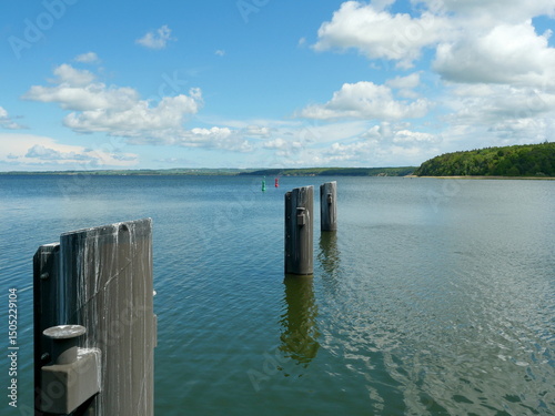 Fototapeta Naklejka Na Ścianę i Meble -  Massive bollards in water for large passenger ships. Technical scene with clear function. Space for texts and designs