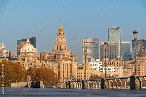 Morning sunrise of Historical architecture on the bund of Shanghai with reflection of buildings in city Shanghai, China