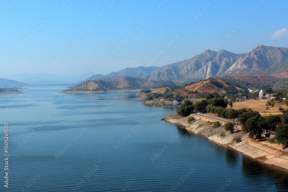 Naklejka premium Beautiful landscape view of calm waters and mountains near a scenic river during a clear day