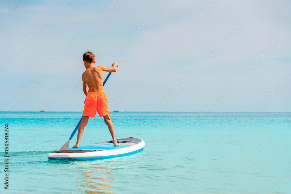 Obraz premium Photo from Hurghada in Egypt of boy on paddleboard