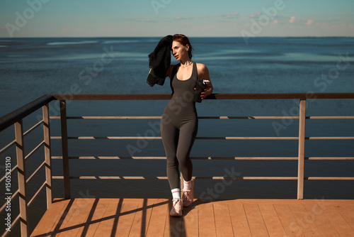 Running concept. Sporty girl running outdoors along river bank. panorama. healthy lifestyle