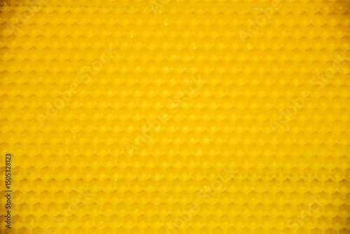Yellow honeycomb on a wooden table