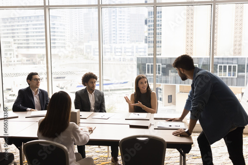 Round table meeting. Millennial businesswoman conference training event member speak give idea propose plan to diverse associates and leader boss director coach gathering on workshop briefing seminar
