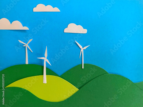 A handmade paper collage illustrates white wind turbines on rolling hills beneath a bright sky, representing green energy and sustainable power solutions