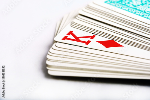 Photos the king of diamonds peeks out from a deck of cards