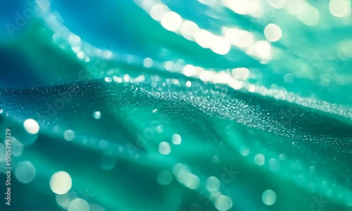Abstract blue-green liquid with bright bokeh