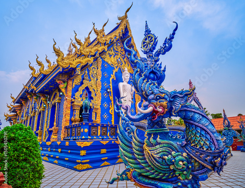 Viharn Hall with Buddha Statues and ornate sculptures, Blue Temple, Chiang Rai, Thailand photo