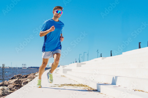 Energizing run along a sunny waterfront pathway with clear blue skies and steps underfoot
