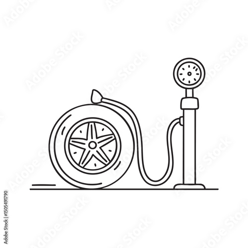 A tire beside an air pump on a driveway