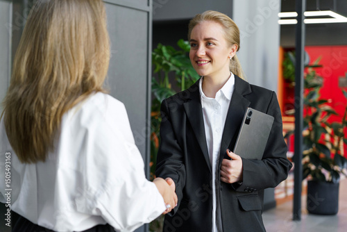 Wallpaper Mural Successful business meeting between two professionals in modern office setting while networking Torontodigital.ca
