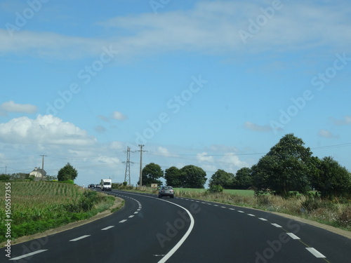Turning on a departmental road in the Normandy countryside - Virage sur une route départementale dans la campagne normande