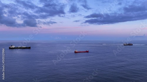 Wallpaper Mural Blue hour arcing aerial view of three anchored freighters in open ocean Torontodigital.ca