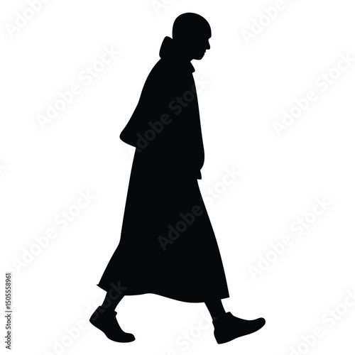 Dark Silhouette of a Person Walking in Long Coat on White Background