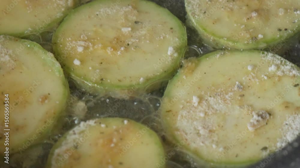 Zucchini Slices Frying in Oil Zucchini Slices Frying in Oil