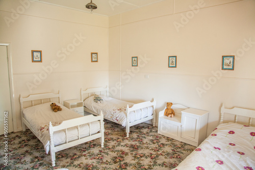 Bedroom with three single beds in a country homestead