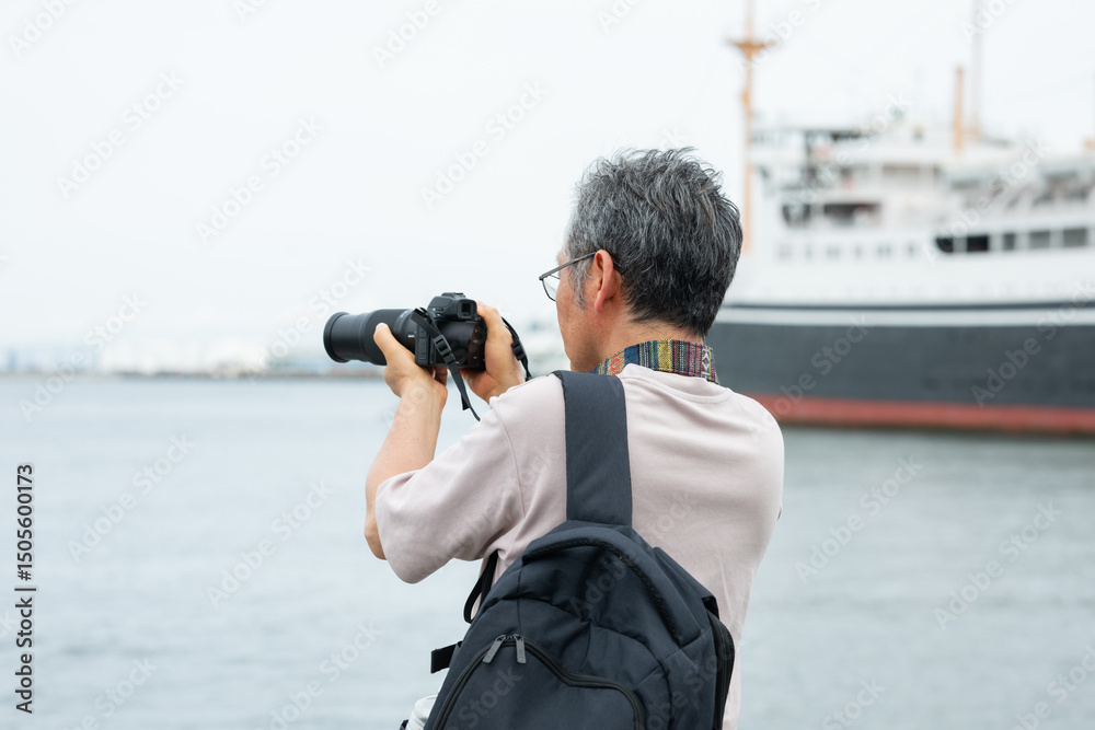 Obraz premium カメラを構える男性