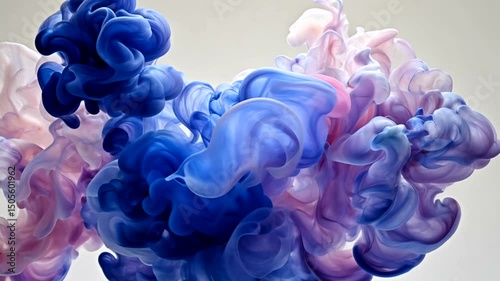 Ethereal clouds of swirling ink in ethereal blue, violet, & pink hues on light backdrop, creating an organic & dreamy abstract display