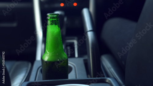 Drinking beer while driving is illegal and can cause serious accidents.