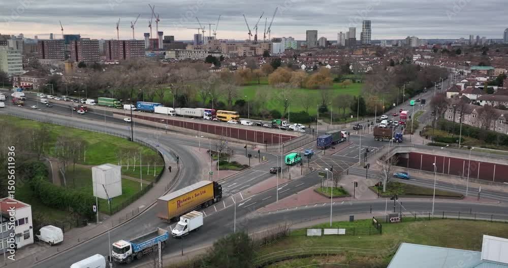 Highway traffic intersection bridge point and city in the back ground, slowmo , panoramic curve shot , London UK