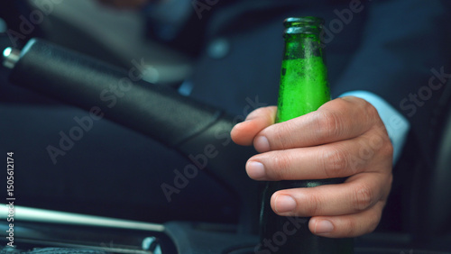 Drinking beer while driving is illegal and can cause serious accidents.
