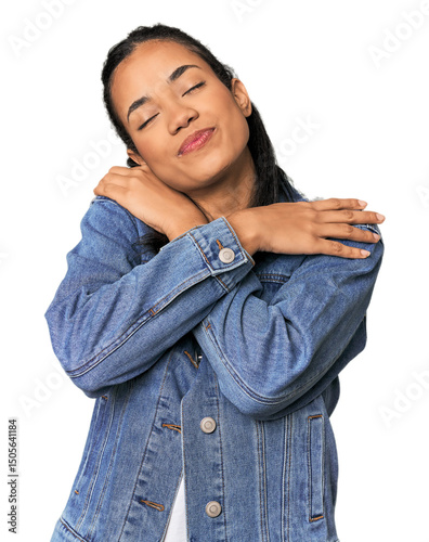 Papier peint Young Filipina woman hugs, smiling carefree and happy.