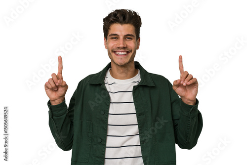 Young handsome caucasian man isolated on white background indicates with both fore fingers up showing a blank space.