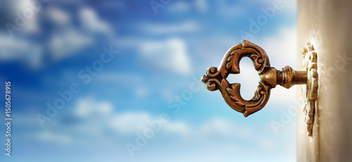 An old key in a keyhole on the background of an sky, macro photography. Retro style. The key to knowledge. Concept and idea for history, education, business, security, secret background.