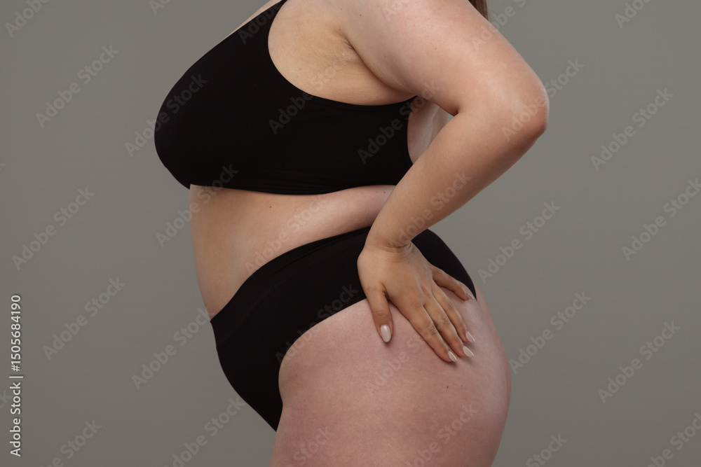 Fototapeta premium Side View of Womans Body Embracing Natural Curves