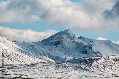 Snow-covered Snæfell mountain under winter skies in East Iceland...