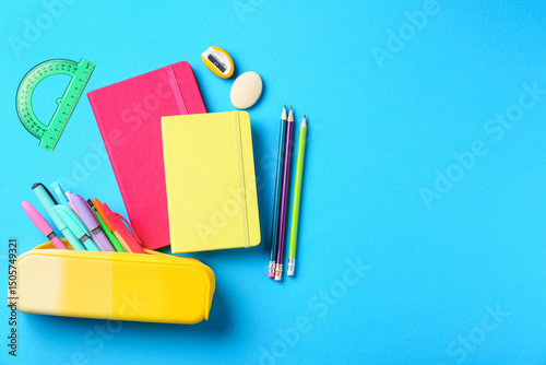 Wallpaper Mural Pens and other stationery on light blue background, flat lay. Space for text Torontodigital.ca
