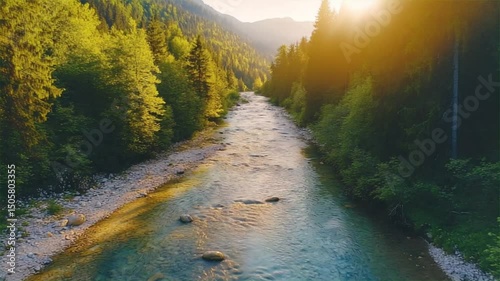 Golden autumn sunset paints the river, forest, and mountain landscape with vibrant leaves and a scenic path.