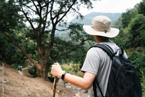 asian man hiking in mountain