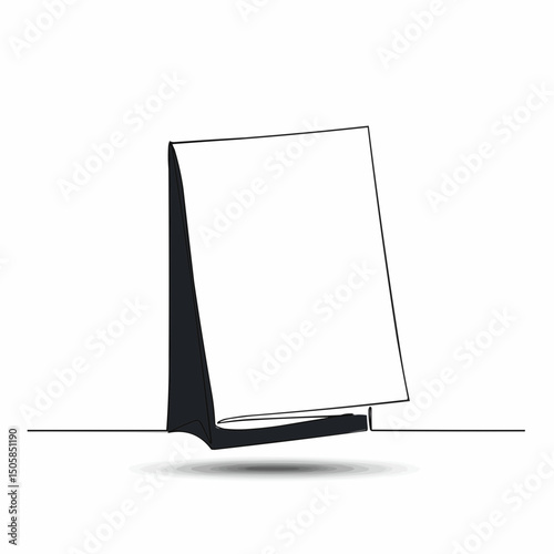 Simple white notepad on a flat surface, displaying a blank page