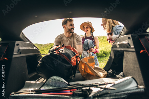 Friends Preparing Picnic From Stuffs From Car