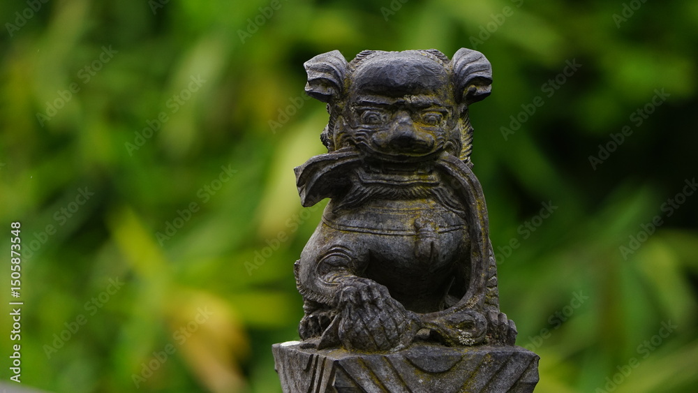 Chinese statue in the bamboo garden Chinese statue in the bamboo garden
