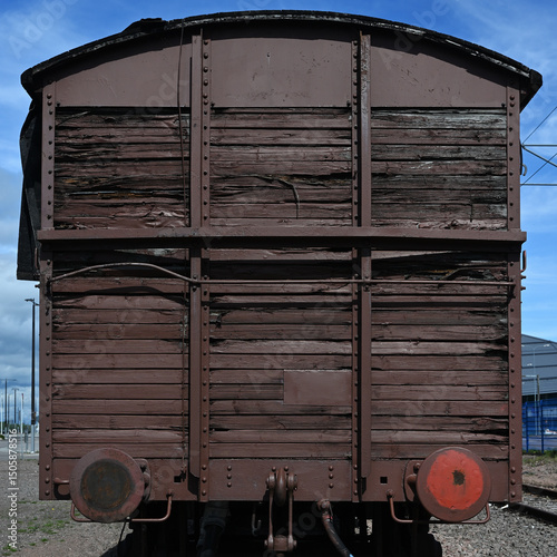the rear view of a vintage wooden freight railcar