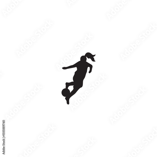 Silhouette of female soccer player kicking a ball with ponytail action shot
