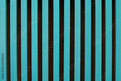 turquoise wooden slats vertically forming a pattern