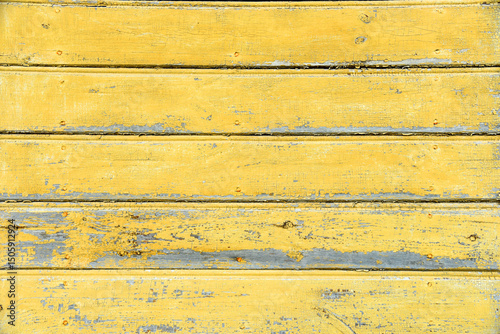 Wallpaper Mural Wooden board background in old paint texture. Natural background of old wooden board painted yellow. Yellow board as background or texture. Cracked Board with yellow old paint. Wood Dirty decoration. Torontodigital.ca